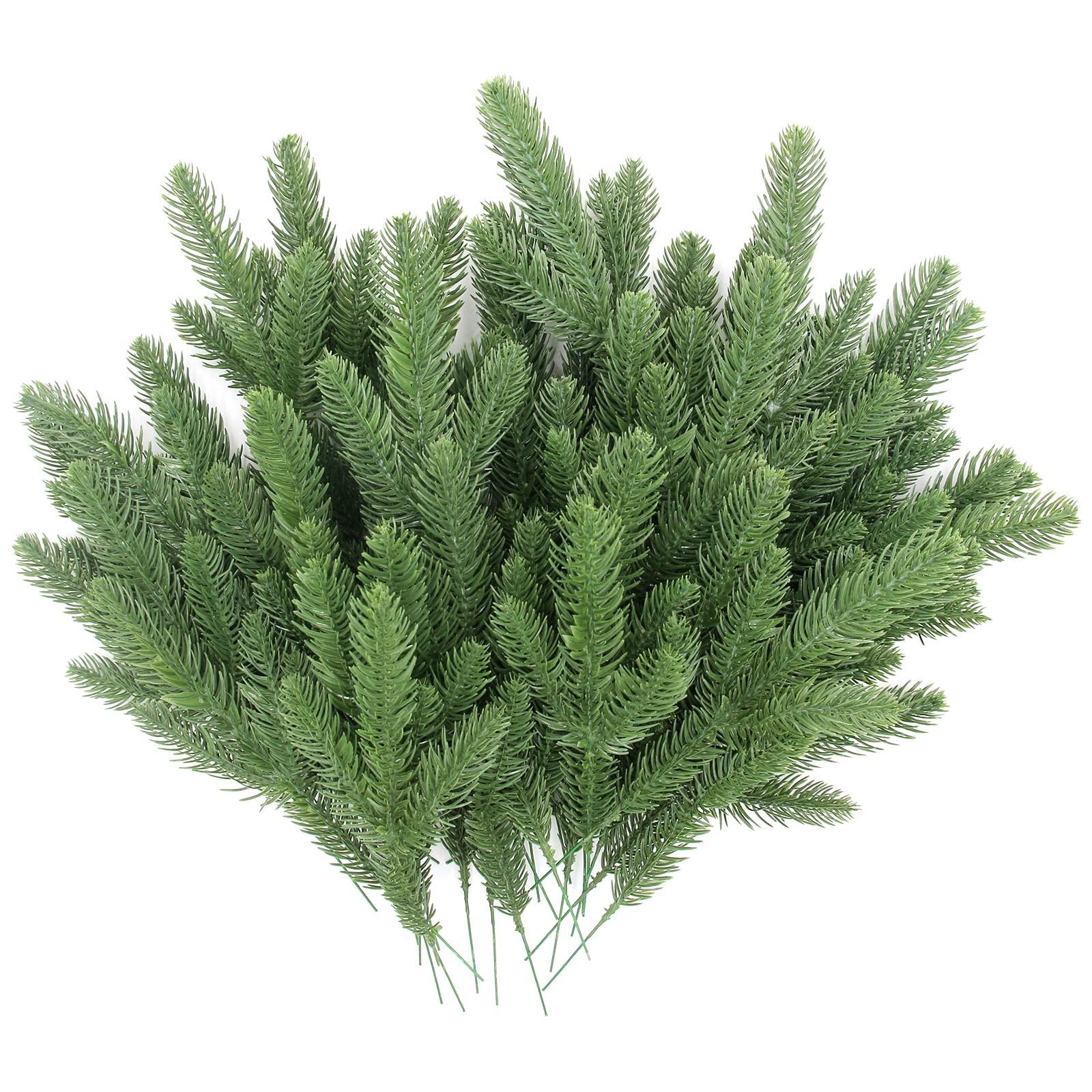 Artificial pine branches with green plastic needles, displayed on a white background.