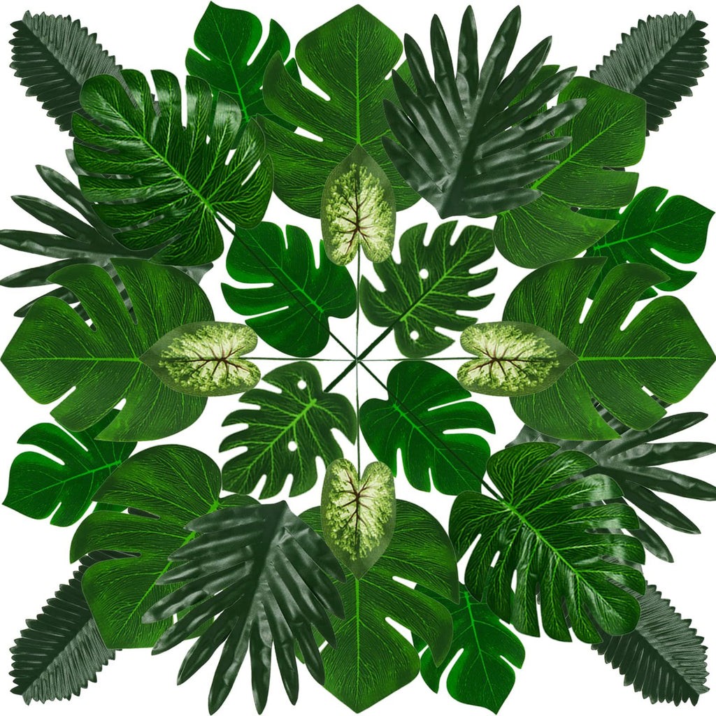 Assortment of artificial tropical leaves arranged in a circular pattern on a white background.