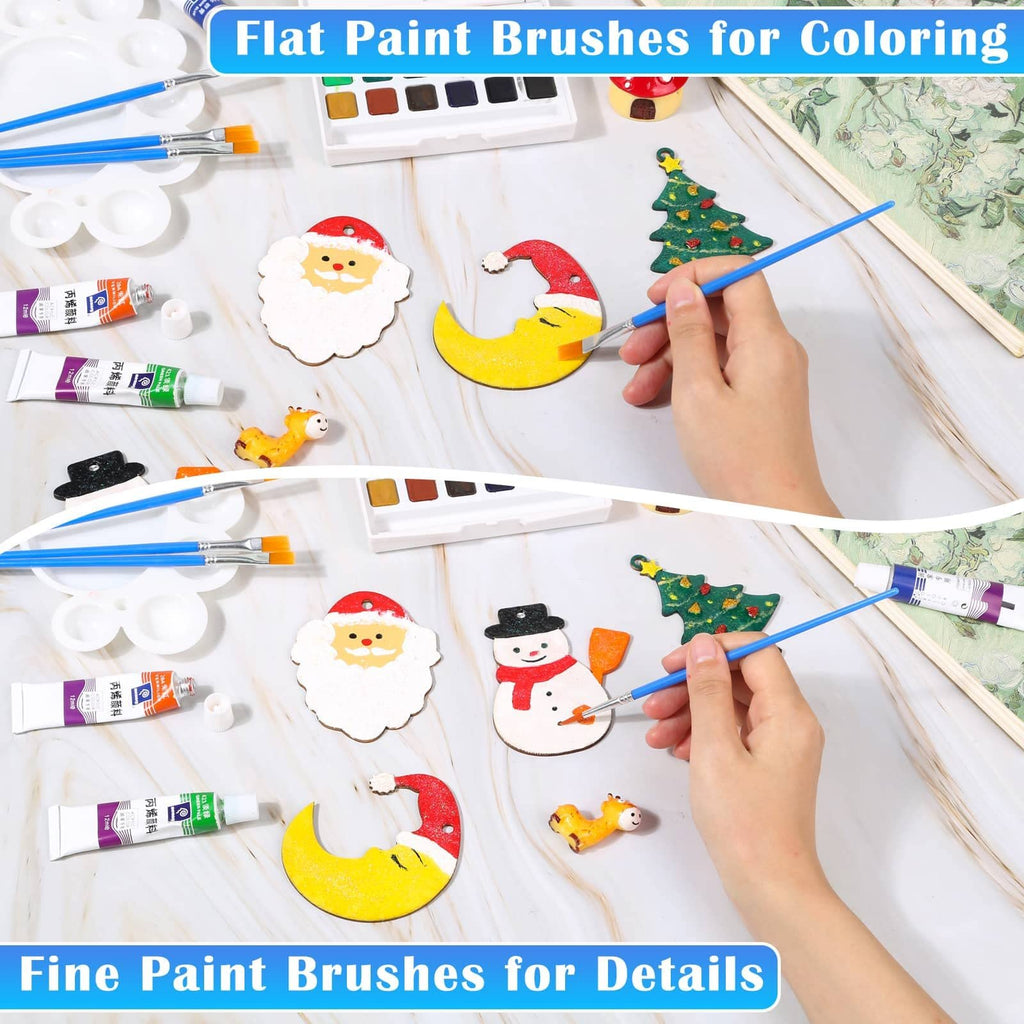 Flat paint brushes and watercolor paints being used to decorate Christmas ornaments like Santa, a snowman, and a moon.