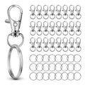 Silver metal swivel lobster claw clasps and key rings arranged on a white background.