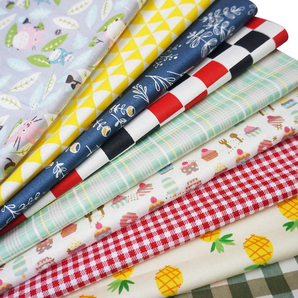 Stack of assorted pre-cut cotton fabric squares with various patterns including animals, geometric shapes, plaid, and food items.