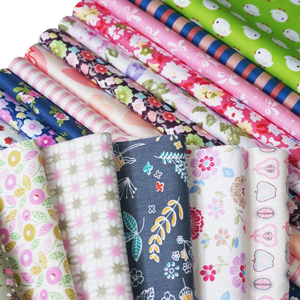 Assorted pre-cut cotton fabric squares with floral, fruit, and abstract patterns, stacked and fanned out.