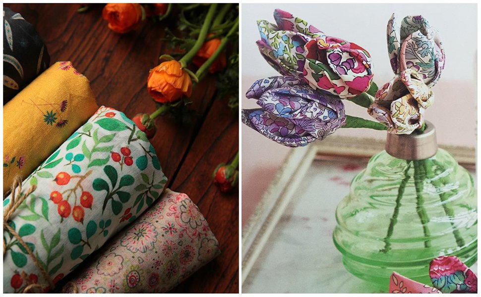 Rolled fabric squares with floral and berry patterns next to orange flowers and fabric tulips in a green vase