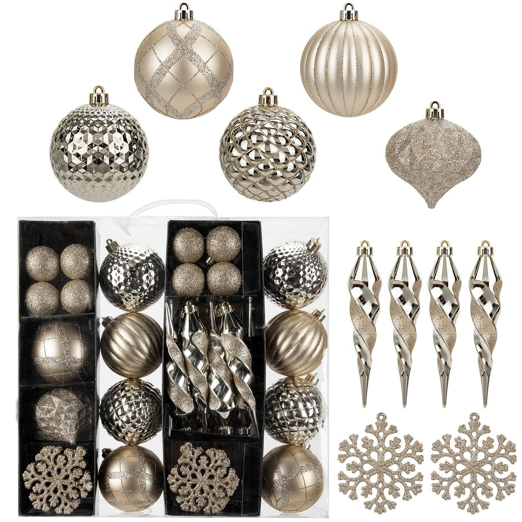 Champagne colored Christmas ornaments including balls, icicles, and snowflakes in a clear display box.
