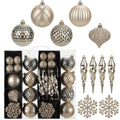 Champagne colored Christmas ornaments including balls, icicles, and snowflakes in a clear display box.