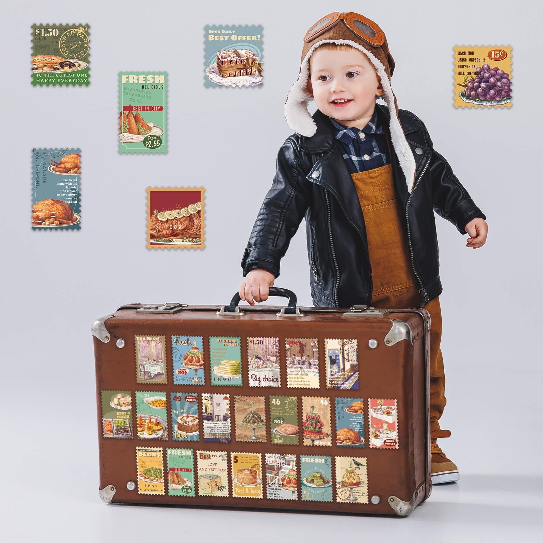 Child in aviator hat holding vintage suitcase covered in food-themed postage stamp stickers