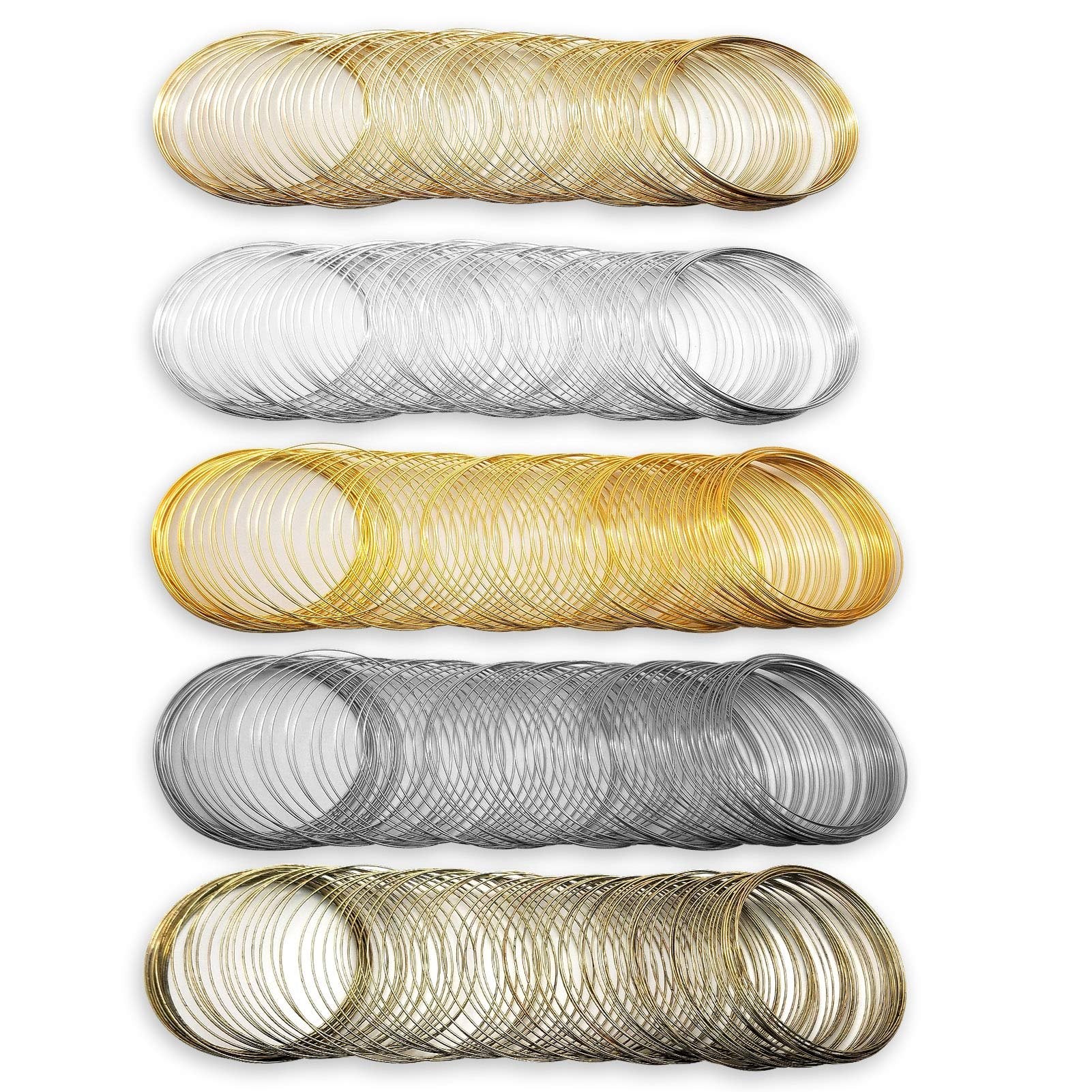 Five rows of coiled memory wire for jewelry making, in gold and silver tones, against a white background.