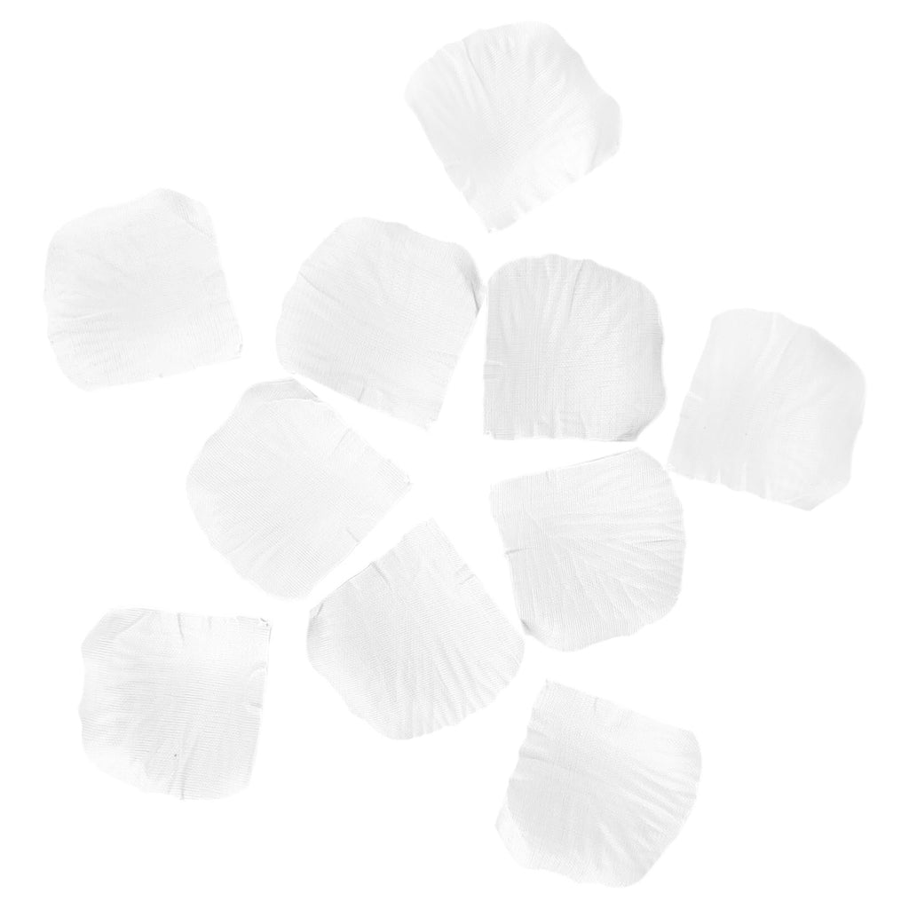 Scattered white artificial rose petals on a white background, top-down view.