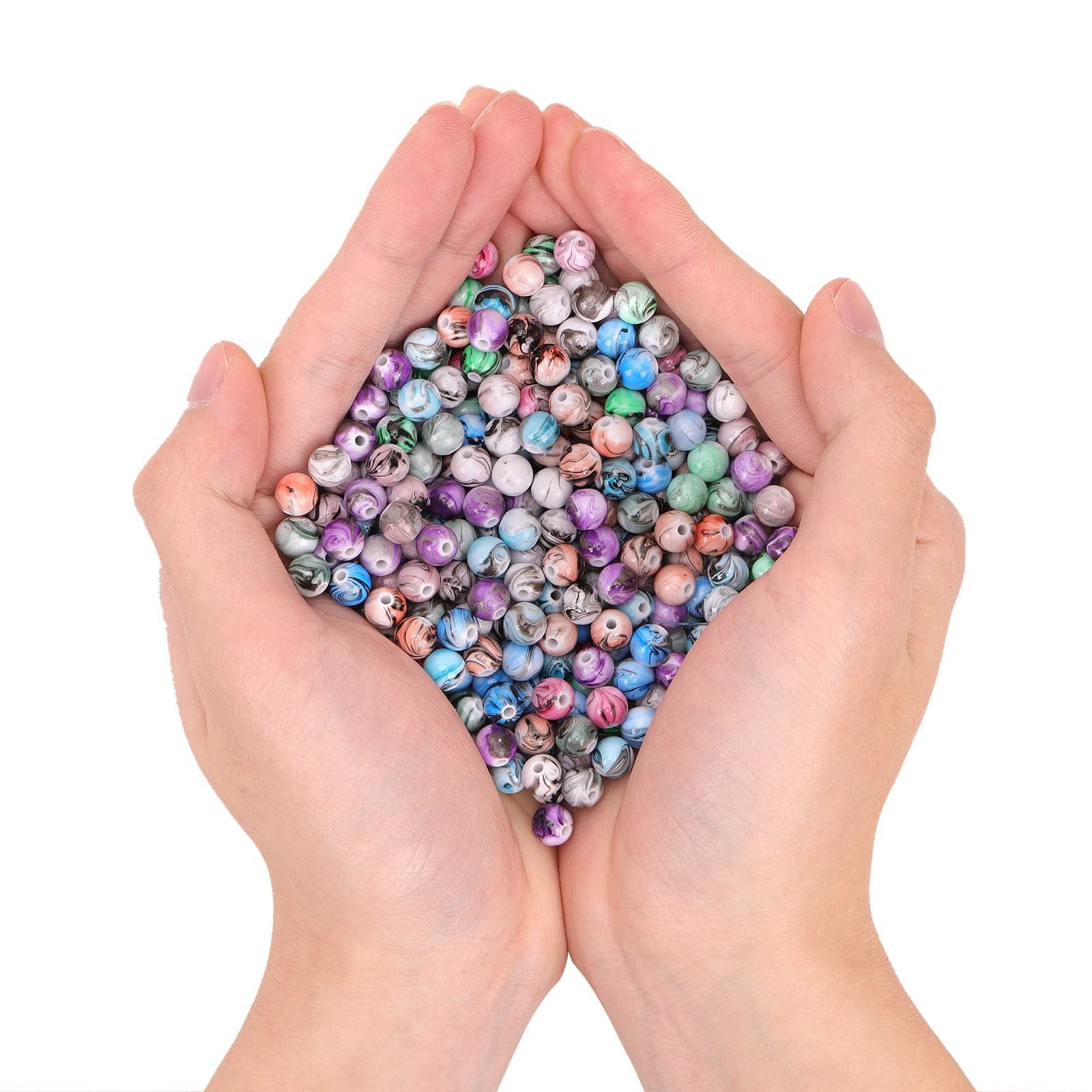 Hands cupping a pile of colorful 8mm acrylic craft beads with ink patterns for jewelry making
