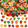 Assortment of fall-themed foam stickers including leaves, squirrels, acorns, pinecones, and pumpkins, some with glitter.