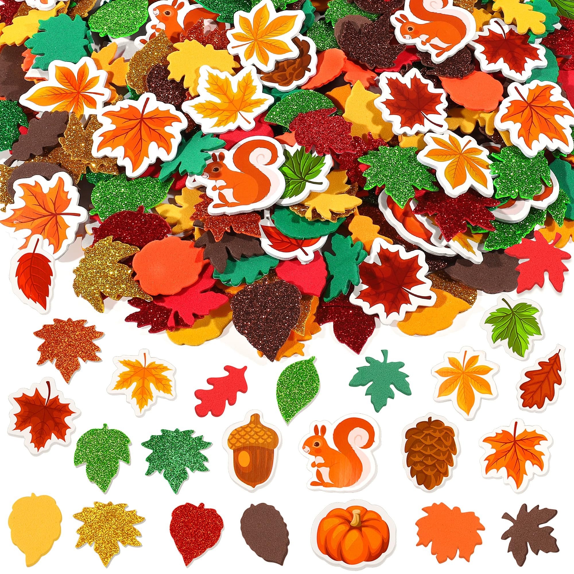 Assortment of fall-themed foam stickers including leaves, squirrels, acorns, pinecones, and pumpkins, some with glitter.