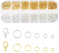 Set of gold and silver open jump rings and lobster clasps in a divided plastic organizer case, with samples laid out below.