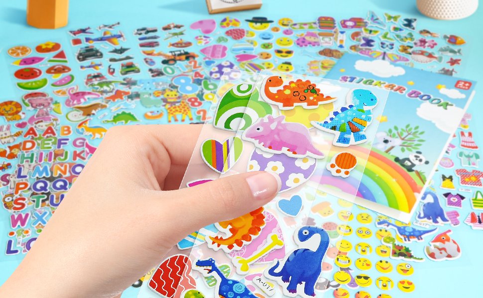 Hand holding puffy stickers featuring dinosaurs, animals, trucks, cars, numbers, and emojis, with a sticker book in the background.