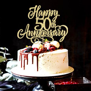 Golden glitter 'Happy 50th Anniversary' cake topper on a decorated cake