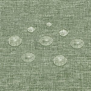 Sage green linen textured tablecloth with water droplets showing waterproof feature
