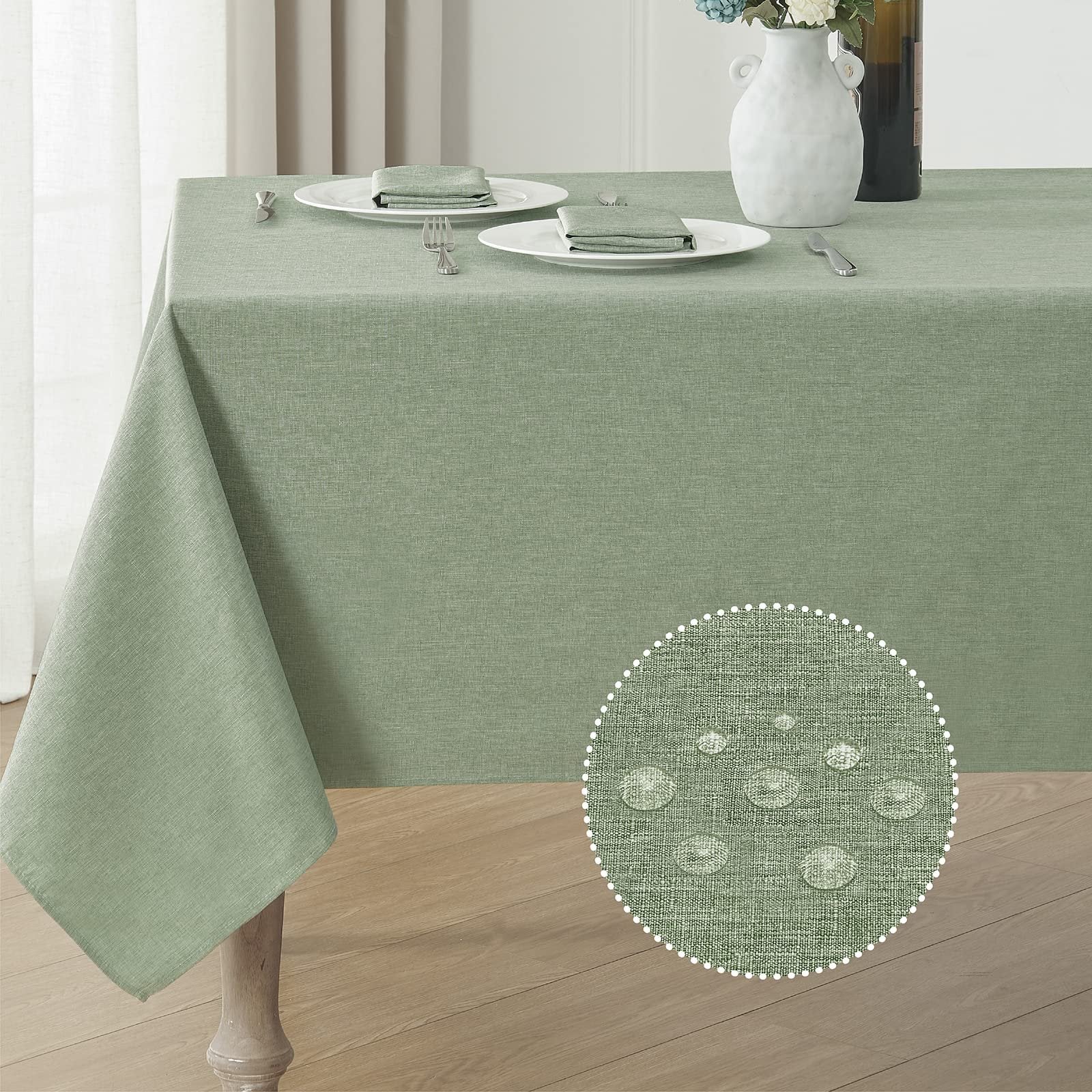 Sage green linen textured tablecloth draped over a table, with a close-up inset showing water droplets on the fabric.