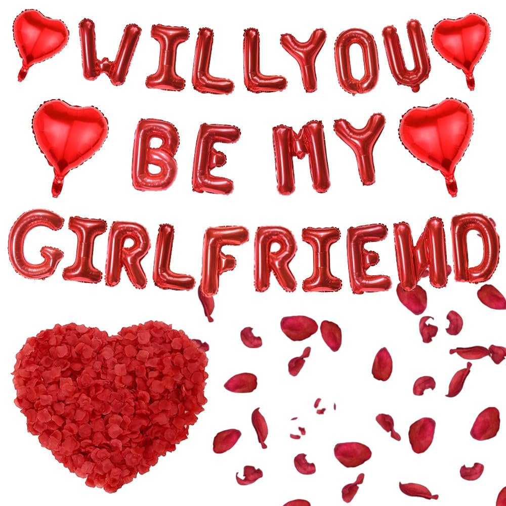 Red heart and letter balloons spelling 'Will You Be My Girlfriend' with rose petals and a heart-shaped pile of petals.