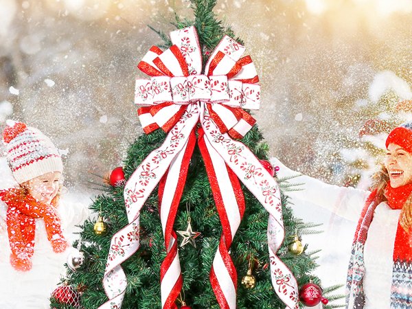 Christmas tree topper bow with candy cane pattern ribbon, on a decorated tree with children in winter attire.