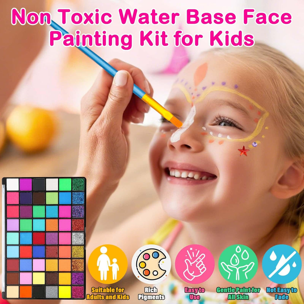 Close-up of a child's face being painted with a brush from a large color palette kit.
