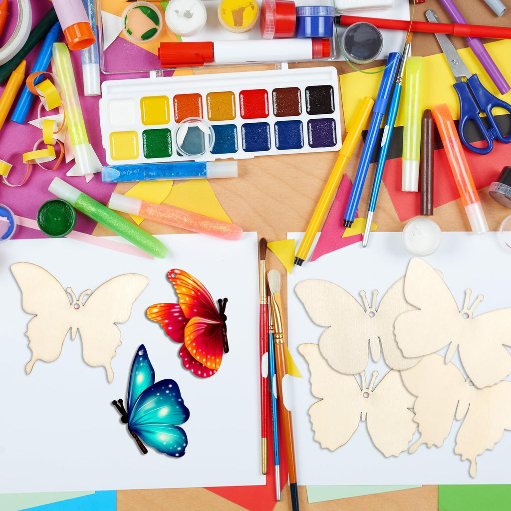 Unfinished wooden butterfly cutouts and colorful craft supplies arranged on a surface