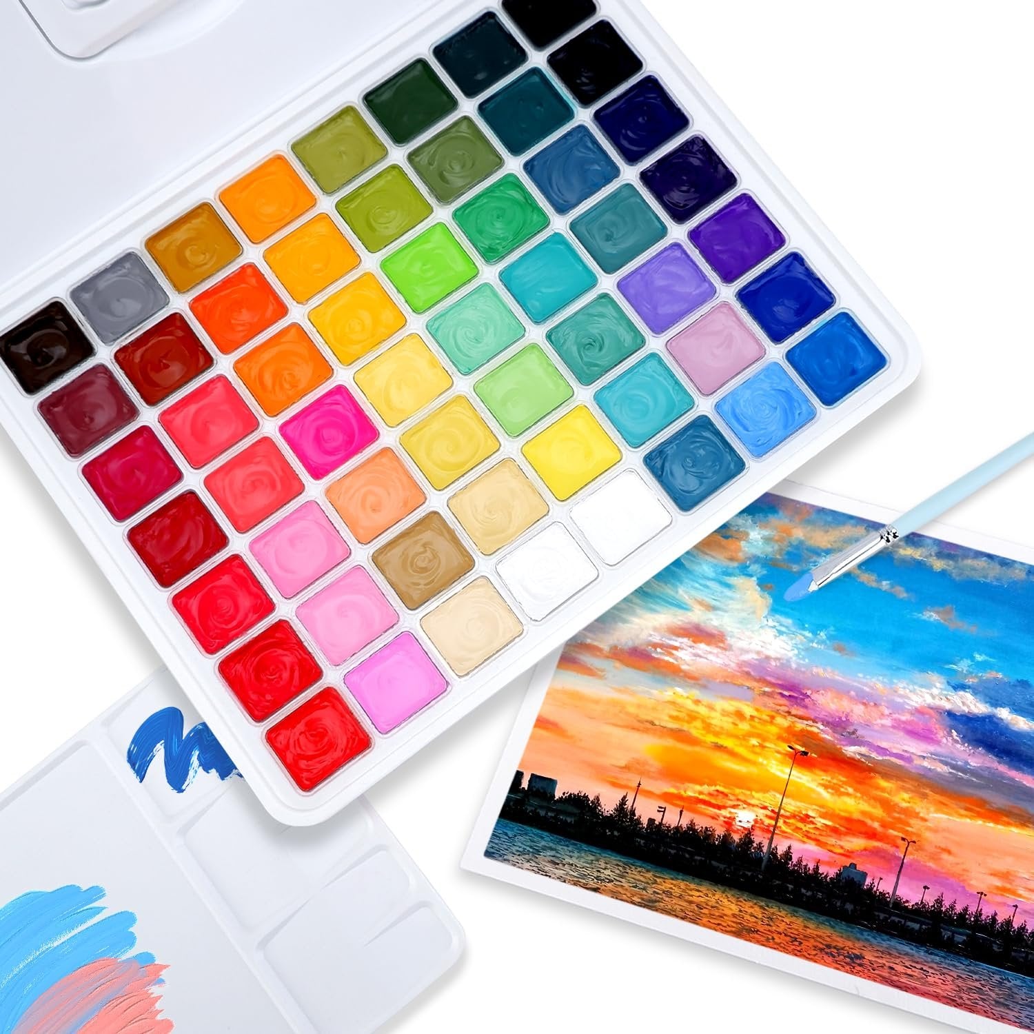 Open 56-color gouache paint set with jelly cups and a painting of a sunset