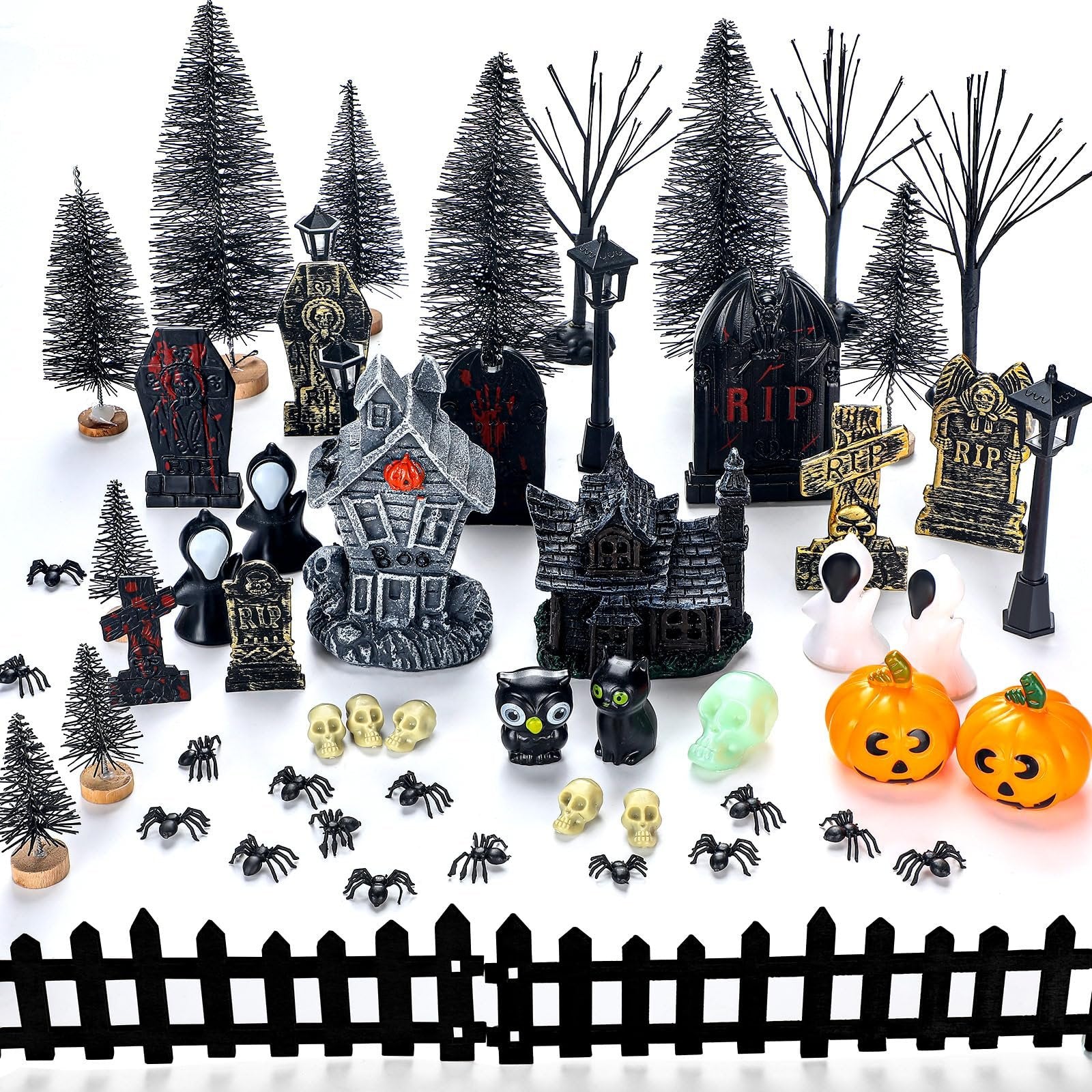 Halloween village accessories set including haunted houses, tombstones, trees, fence, streetlamps, spiders, skulls, ghosts, pumpkins, and owls.