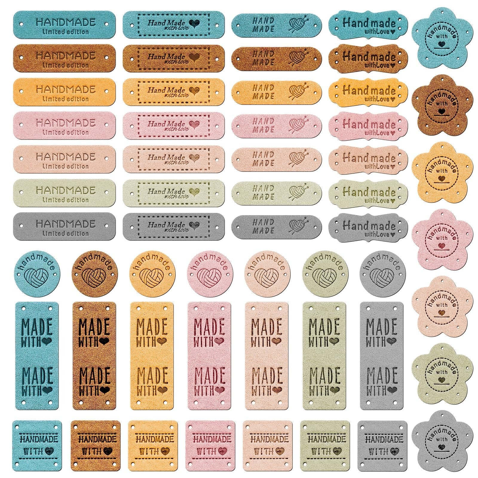 Assortment of 56 artificial leather handmade labels in rectangle, flower, and round shapes, in 7 colors.