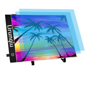 A4 LED light pad with palm tree sunset design, angled view with blue protective sheets