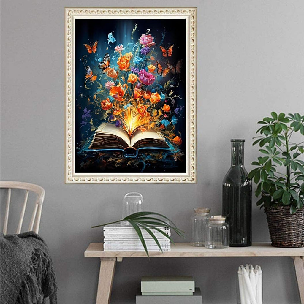 Diamond painting kit featuring an open book with colorful flowers and butterflies emerging from its pages.