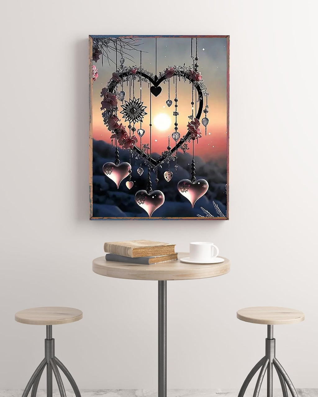 Diamond painting kit of a heart-shaped dream catcher with hanging hearts and a sun setting behind mountains