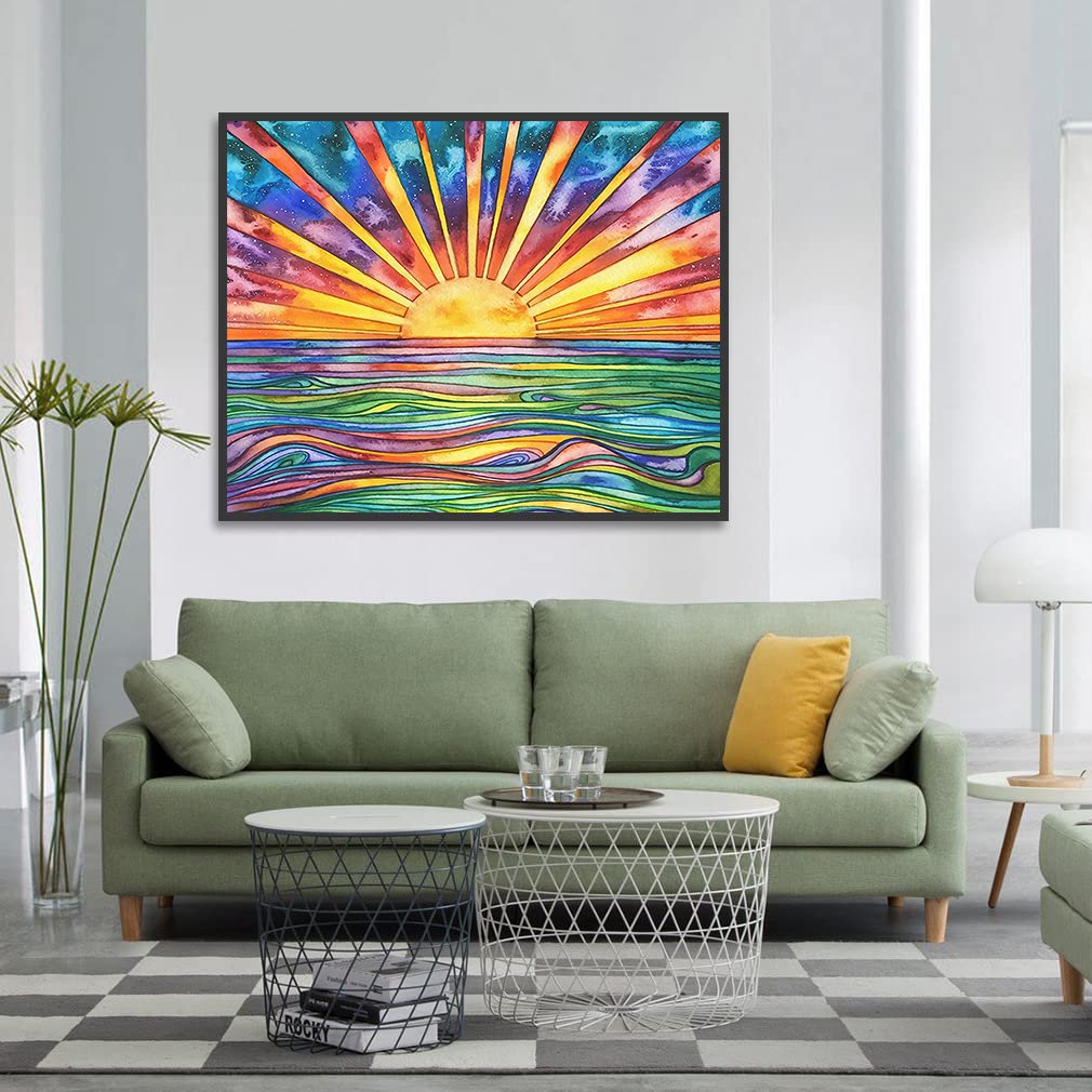 Framed abstract sunrise over colorful wavy ocean, displayed above a green sofa in a living room.