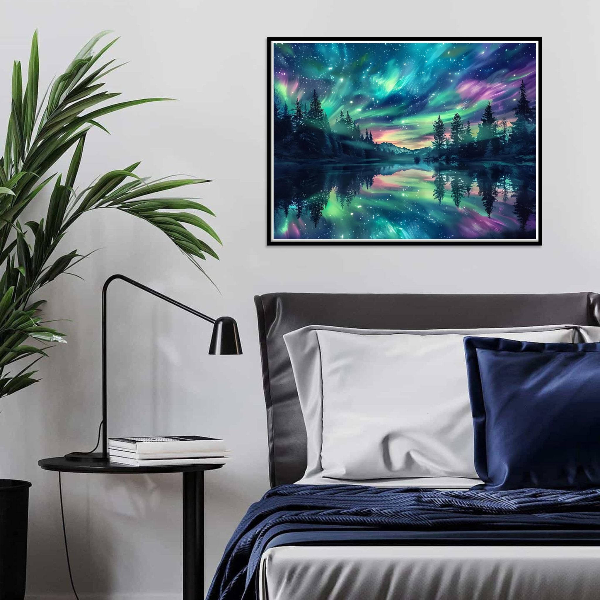 Diamond painting of a starry night sky over a forest and lake, framed and hung above a bed.