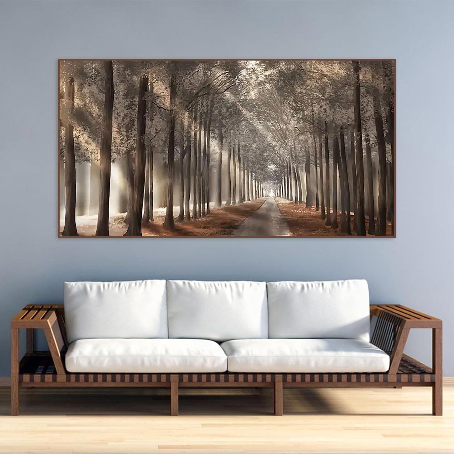 Diamond painting of a tree-lined path with sunlight filtering through the trees, displayed above a sofa.