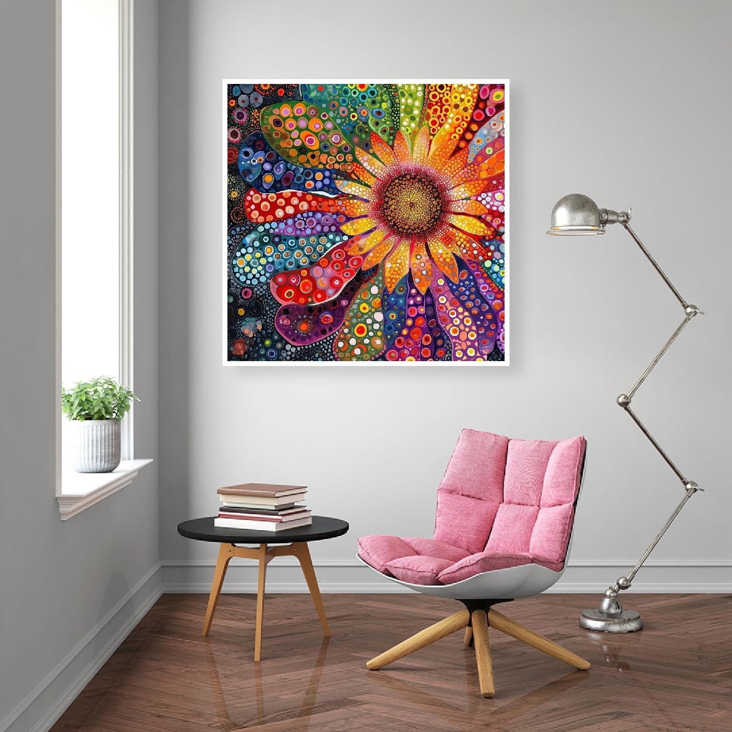 Colorful abstract flower diamond painting artwork framed on a wall in a modern living room setting with a pink chair and side table.