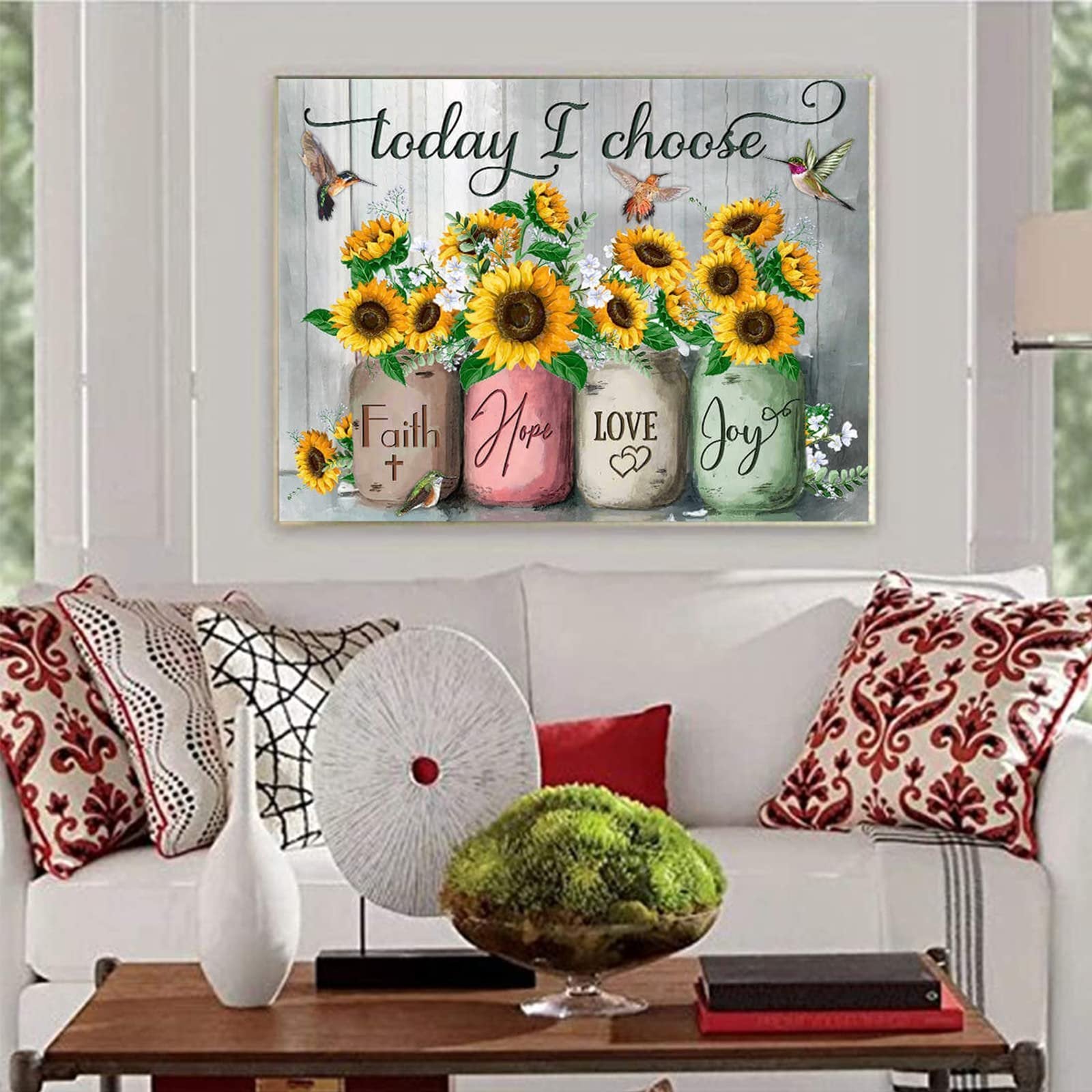 Sunflower floral arrangement in mason jars with inspirational words, displayed in a living room setting.