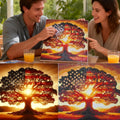 Couple proudly displaying a finished diamond painting of a tree with the American flag pattern on its leaves, with a sunburst behind it.