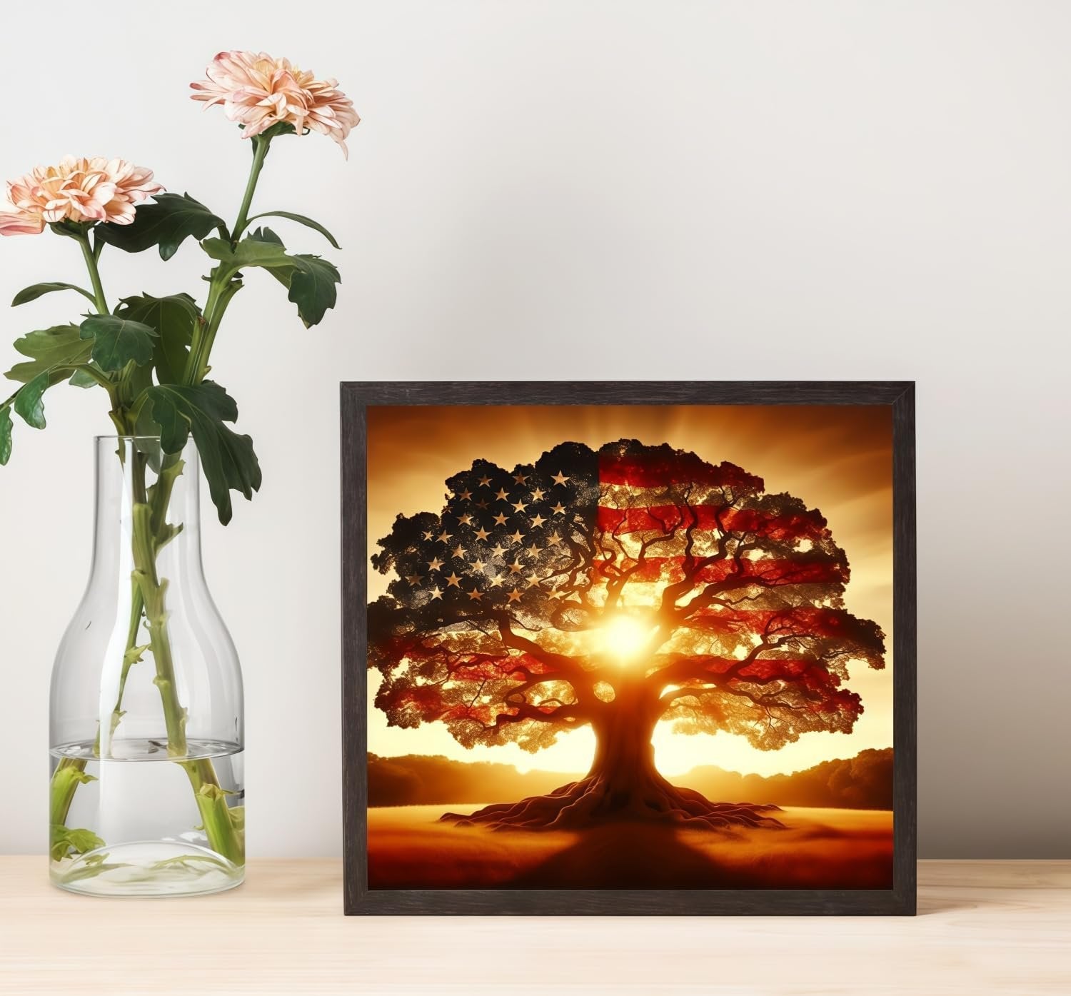Framed artwork of a tree with the American flag pattern on its canopy, set against a sunset.