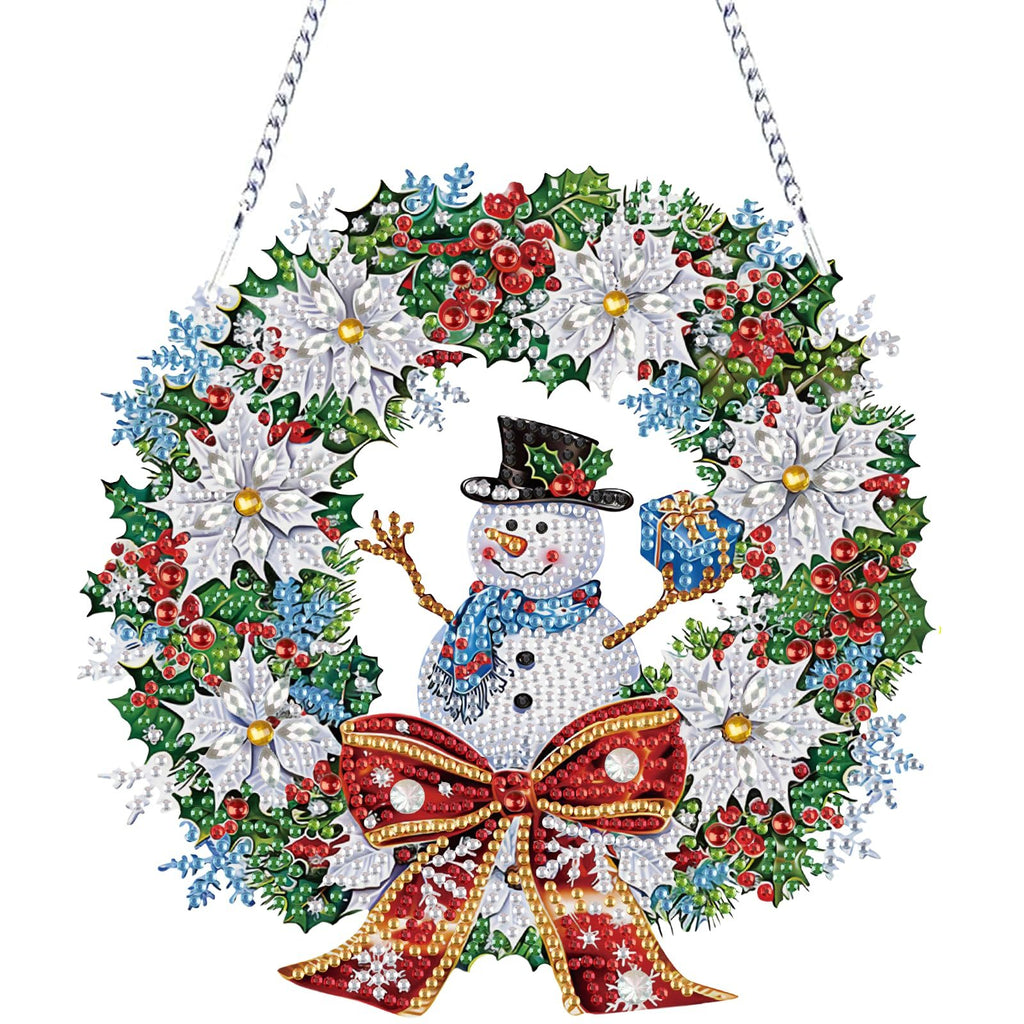 Diamond painting snowman wreath ornament with red bow, white poinsettias, holly, and berries, hanging by a chain.