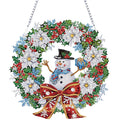 Diamond painting snowman wreath ornament with red bow, white poinsettias, holly, and berries, hanging by a chain.