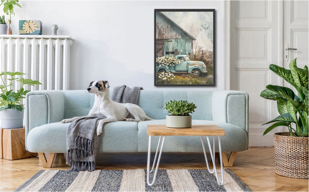 Living room scene with a dog on a sofa and a framed picture of a vintage truck with flowers
