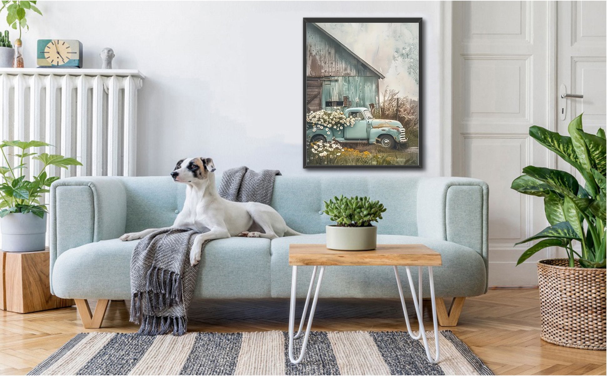 Living room scene with a dog on a sofa and a framed picture of a vintage truck with flowers