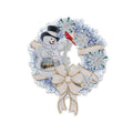 Diamond painting Christmas wreath with snowman, cardinal, snowflakes, and bow on white background