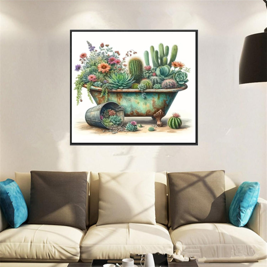 Diamond painting kit featuring a vintage bathtub overflowing with succulents and flowers, displayed above a sofa.