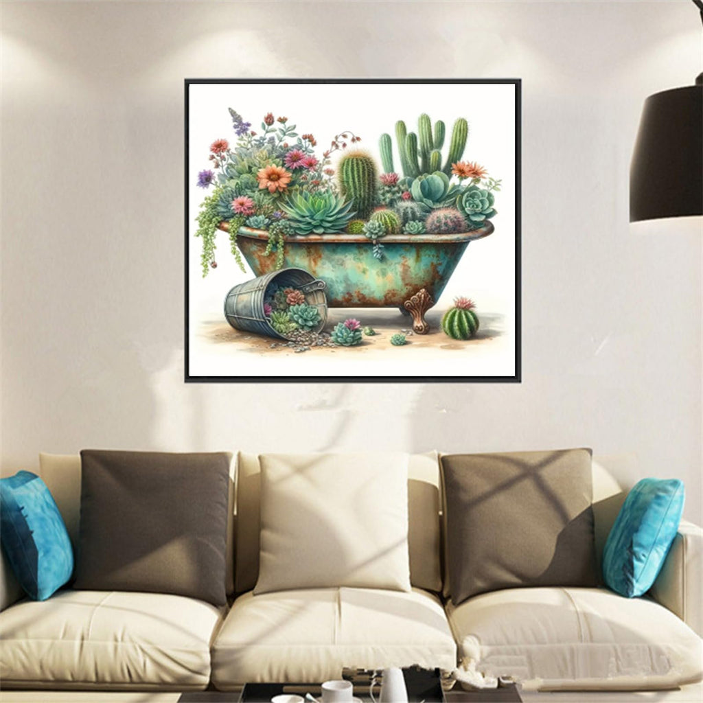 Diamond painting kit featuring a vintage bathtub overflowing with colorful flowers and succulents, with a fallen bucket of succulents nearby, displayed on a wall above a sofa.