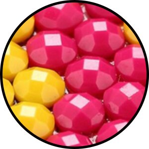 Close-up of faceted yellow and pink diamond painting rhinestones.