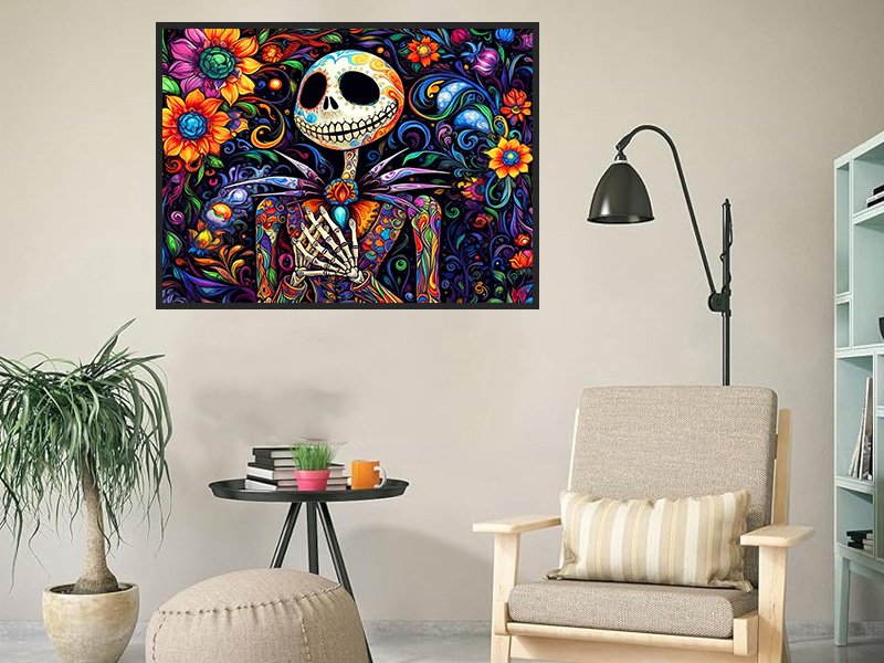 Diamond art painting of a skeleton character with colorful flowers and patterns, framed and hanging on a wall above a side table.
