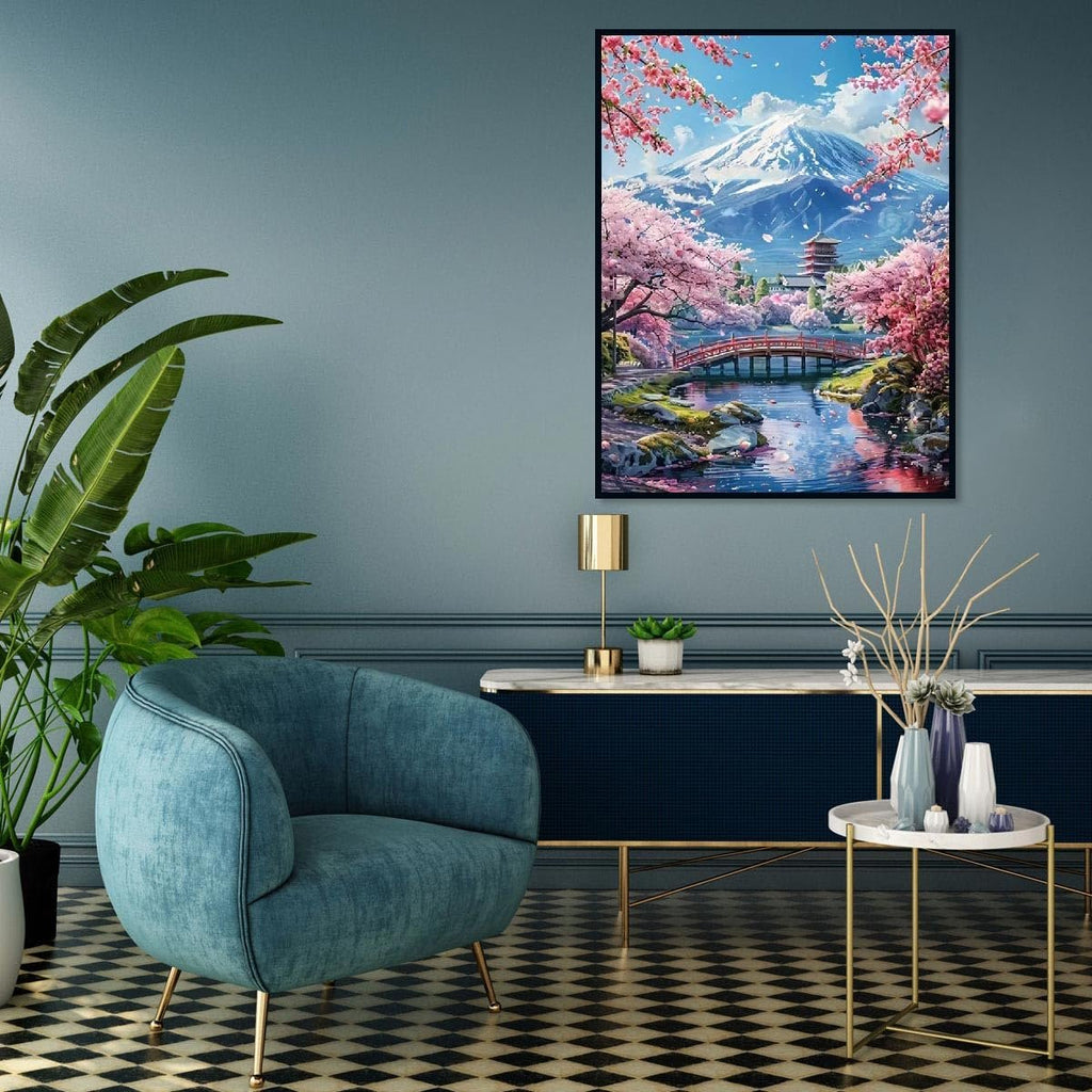 Diamond painting of Mount Fuji with cherry blossoms and a bridge over a river, displayed in a living room setting.