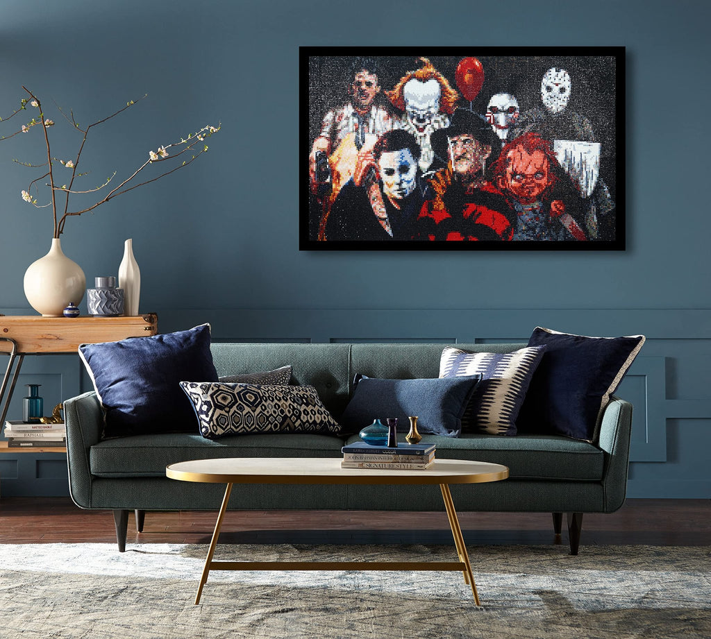Diamond painting of horror movie characters hanging on a wall above a sofa