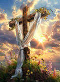 Wooden cross draped with white cloth, surrounded by flowers and greenery, with a dramatic sunset sky.