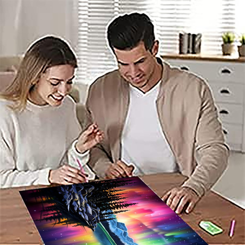 Couple working on a diamond painting kit with an aurora landscape design